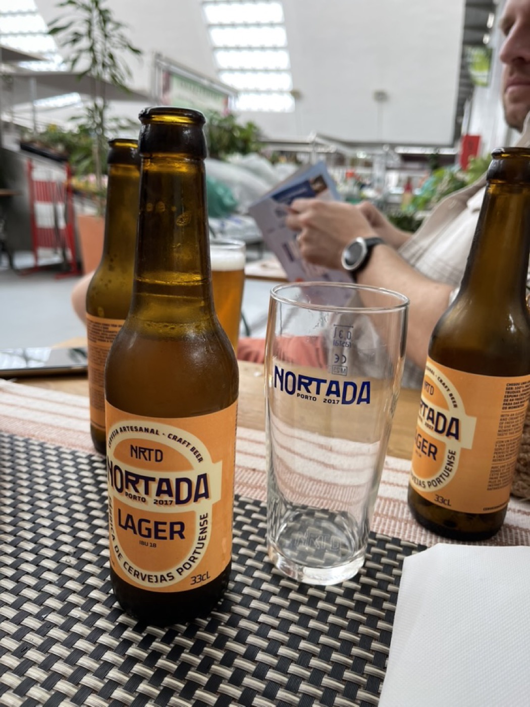 Two bottles of Nortada beer on a table